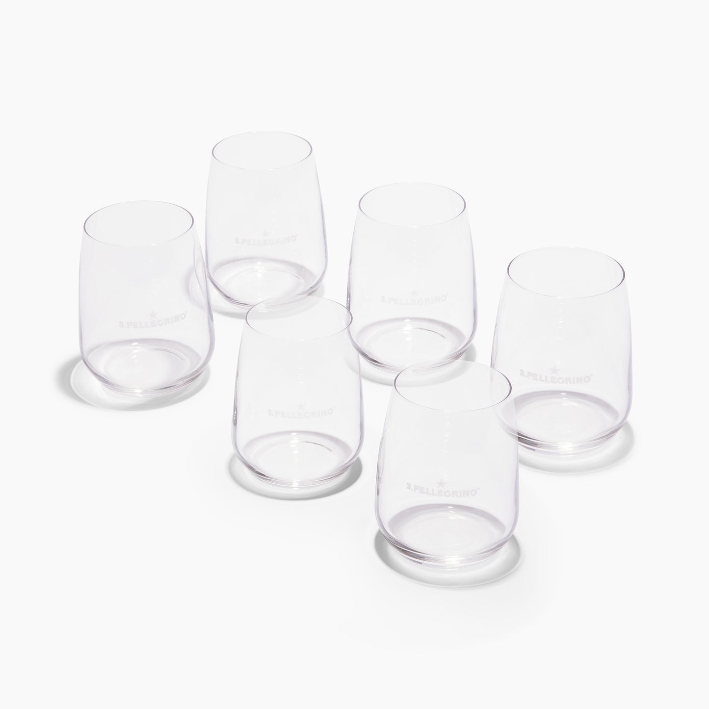 Set of six clear stemless glasses with the S.Pellegrino logo etched on the side.